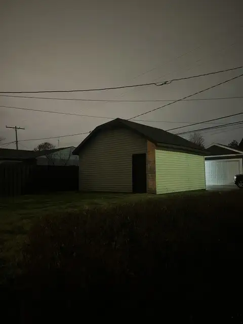 Night falls quietly on this lone garage.